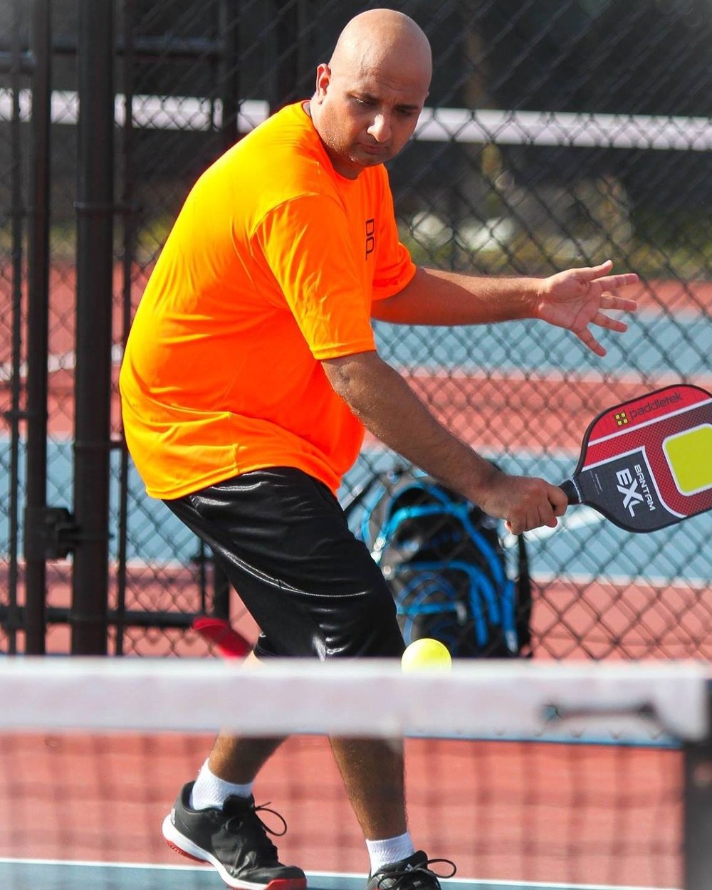 Sudhanshu (Sid) Harshavat, founder of idur.ai, playing pickleball.